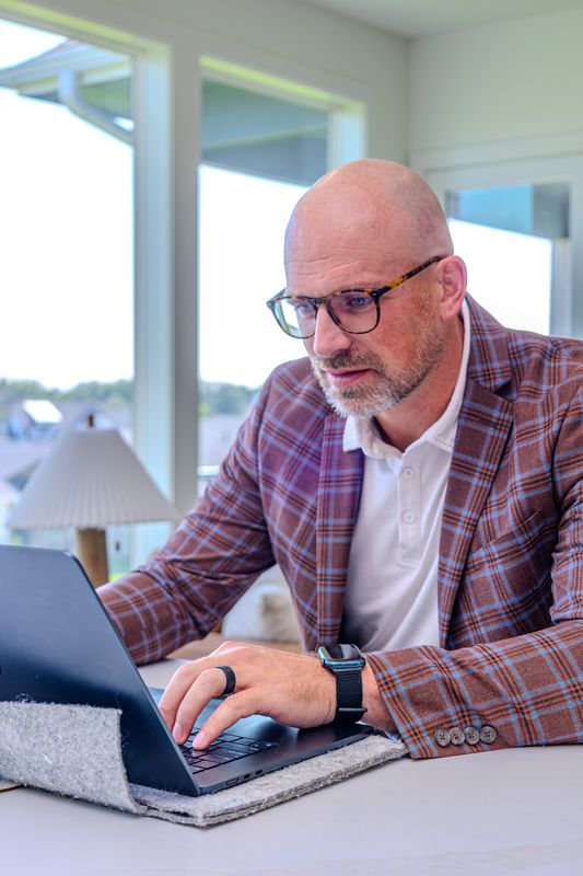 Alex McConeghey reviewing a listing launch plan
